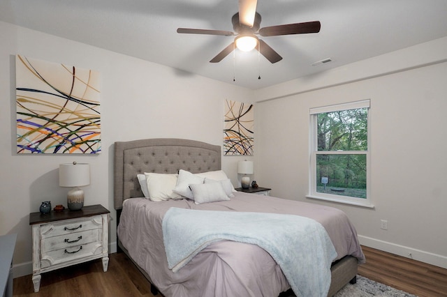 9247 State Highway 13, Kimberling City, MO 65686 - bedroom featuring baseboards, a ceiling fan, dark wood-style flooring, and visible vents