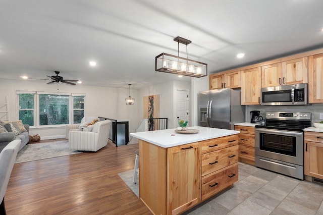 9247 State Highway 13, Kimberling City, MO 65686 - kitchen featuring recessed lighting, open floor plan, light brown cabinets, and stainless steel appliances