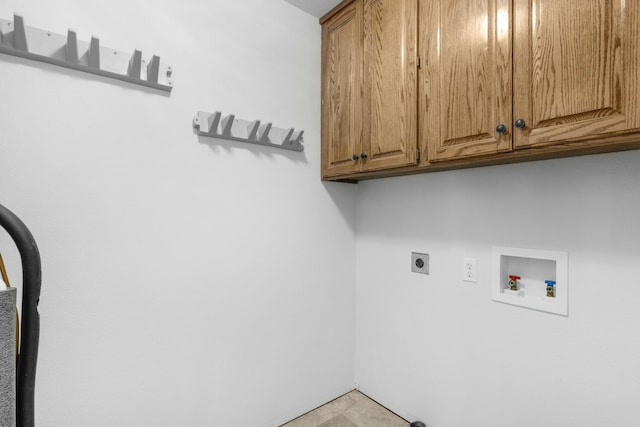 laundry area with hookup for a washing machine, cabinet space, and hookup for an electric dryer