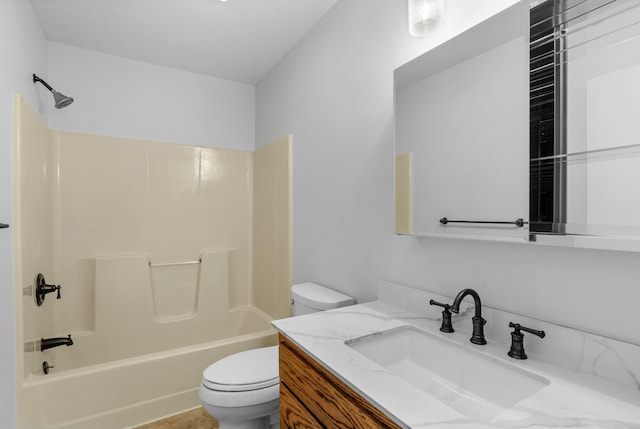 bathroom with toilet,  shower combination, and vanity