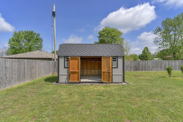 view of shed featuring a fenced backyard