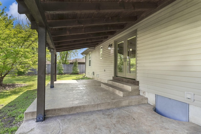 view of patio with fence, french doors, and entry steps