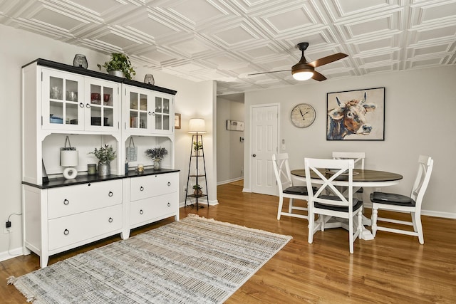 1522 S Oakland Ave, Bolivar, MO 65613 - dining room featuring baseboards, ceiling fan, and an ornate ceiling