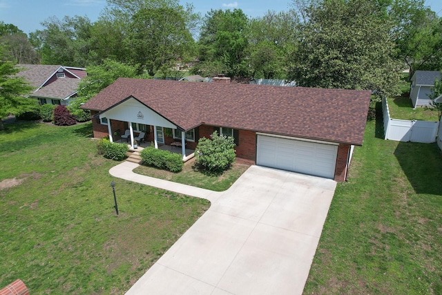 1522 S Oakland Ave, Bolivar, MO 65613 - ranch-style house with fence, covered porch, a shingled roof, concrete driveway, and an attached garage