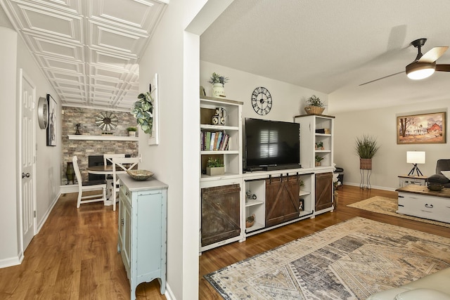 1522 S Oakland Ave, Bolivar, MO 65613 - living room with ceiling fan, dark wood-style floors, and baseboards