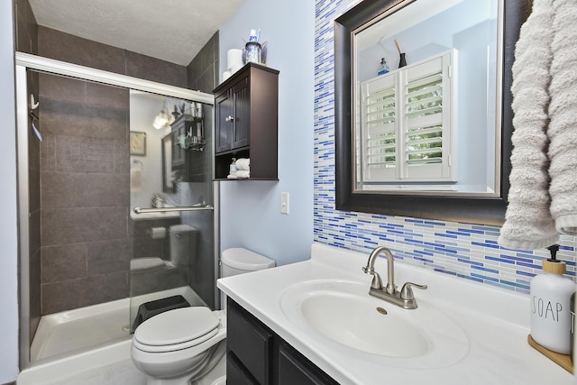 1522 S Oakland Ave, Bolivar, MO 65613 - bathroom with vanity, toilet, tasteful backsplash, and a stall shower