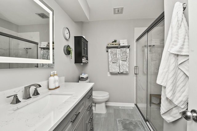 1522 S Oakland Ave, Bolivar, MO 65613 - bathroom with vanity, baseboards, a shower stall, and visible vents