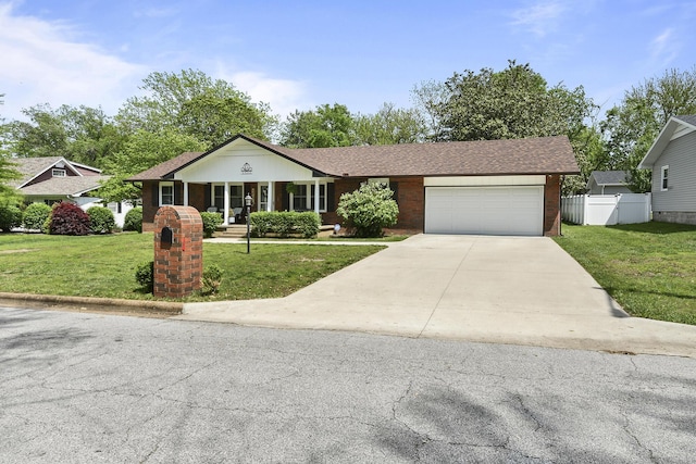 1522 S Oakland Ave, Bolivar, MO 65613 - ranch-style house featuring a garage, a front lawn, fence, brick siding, and driveway