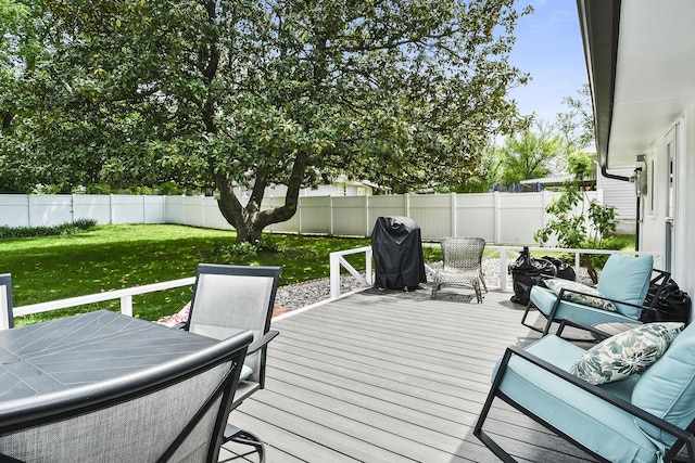 1522 S Oakland Ave, Bolivar, MO 65613 - wooden deck with a lawn, grilling area, and a fenced backyard
