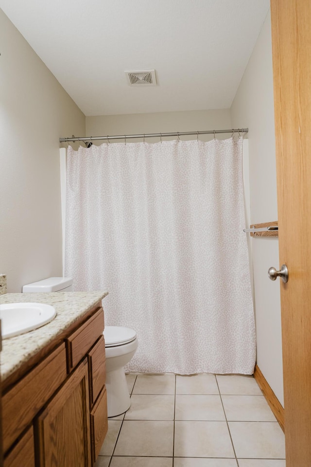 full bathroom featuring visible vents, vanity, curtained shower, toilet, and tile patterned floors