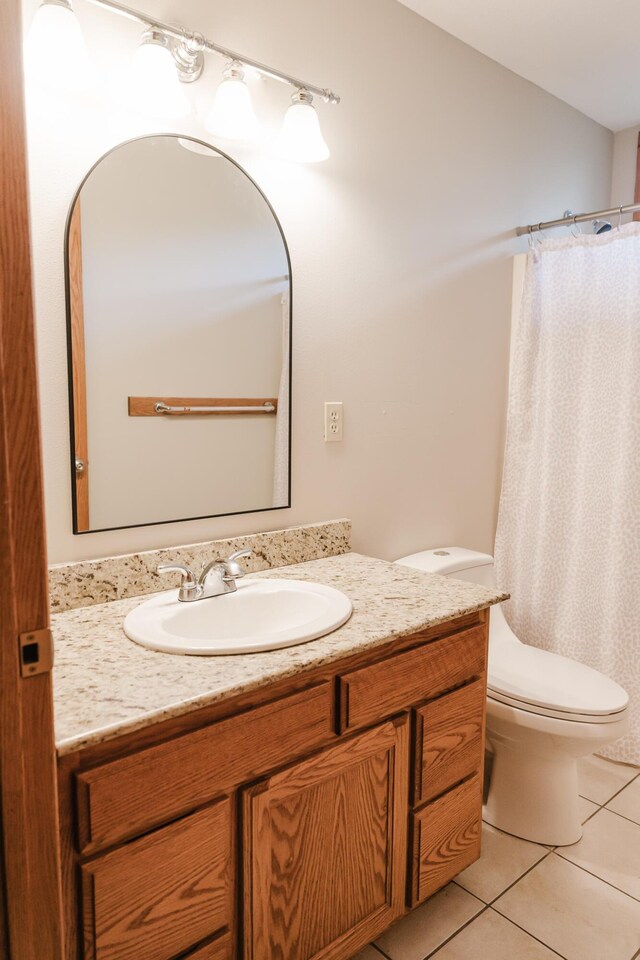 406 S Cedarbrook Dr, Monett, MO 65708 - full bathroom with toilet, tile patterned floors, curtained shower, and vanity
