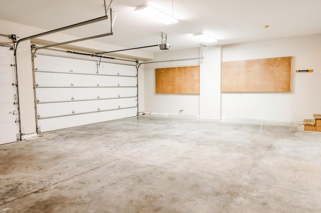 406 S Cedarbrook Dr, Monett, MO 65708 - garage featuring a garage door opener