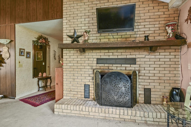 carpeted living area with a fireplace