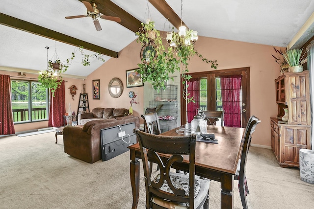 dining area with baseboards, lofted ceiling with beams, a ceiling fan, and light carpet