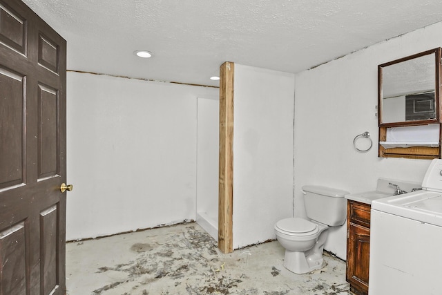 bathroom with washer / dryer, toilet, unfinished concrete floors, recessed lighting, and a textured ceiling