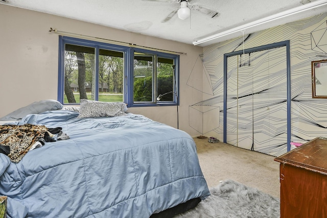 bedroom with carpet and a ceiling fan