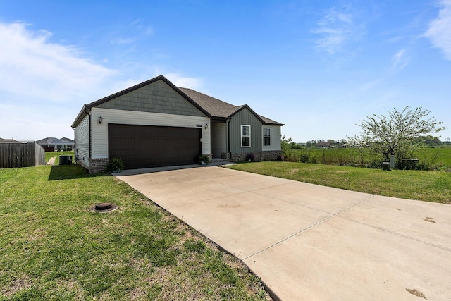 1418 S Lorraine Ave, Republic, MO 65738 - view of front of house featuring an attached garage, a front lawn, fence, and concrete driveway