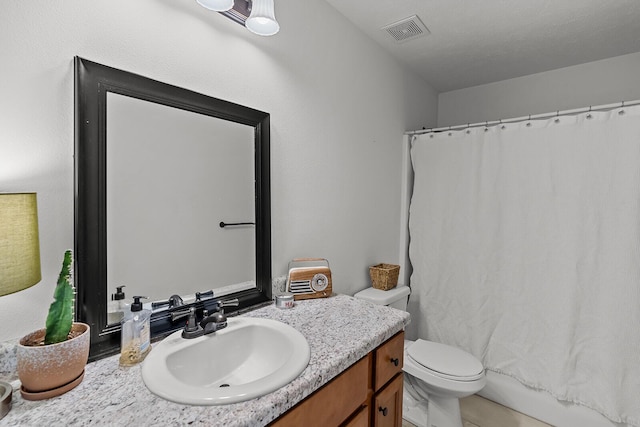 1418 S Lorraine Ave, Republic, MO 65738 - bathroom featuring vanity, toilet, and visible vents