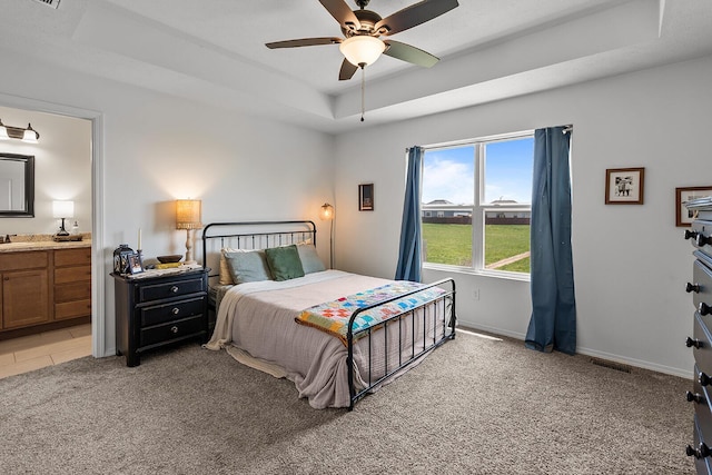 1418 S Lorraine Ave, Republic, MO 65738 - bedroom featuring visible vents, light carpet, baseboards, connected bathroom, and a raised ceiling
