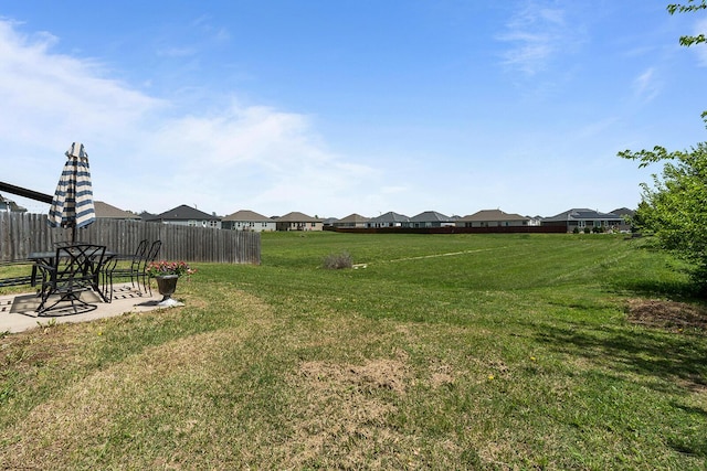 1418 S Lorraine Ave, Republic, MO 65738 - view of yard with fence, a patio, and a residential view