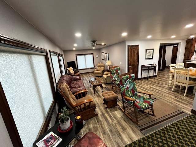 living room featuring recessed lighting, ceiling fan, and wood finished floors