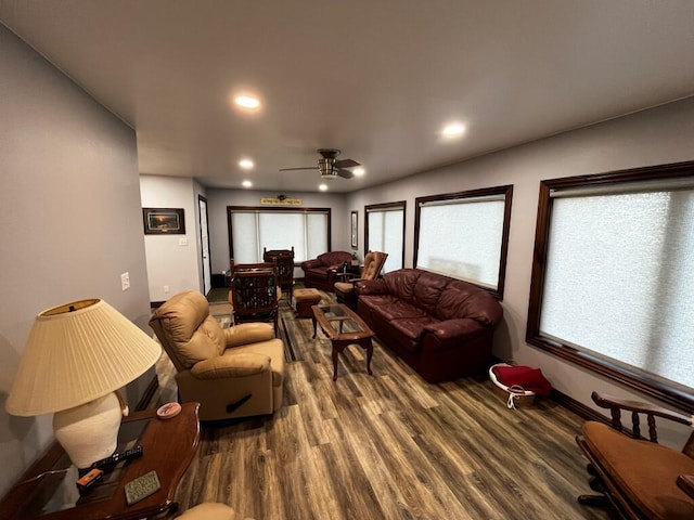 living area with baseboards, ceiling fan, recessed lighting, and wood finished floors