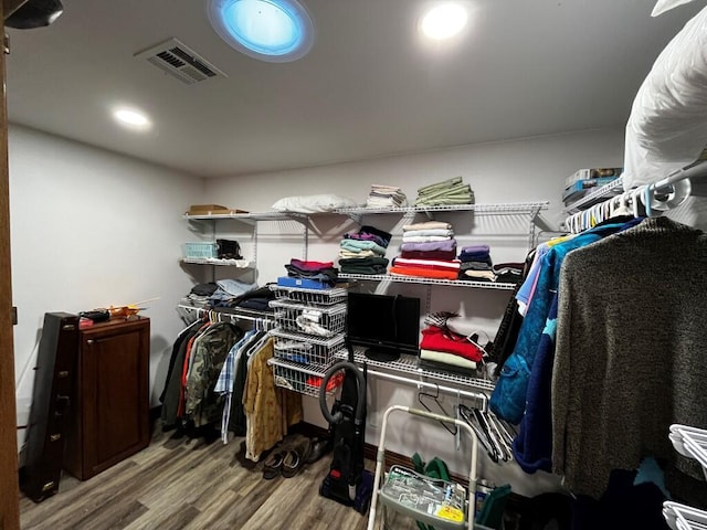 spacious closet with visible vents and wood finished floors