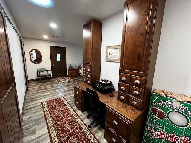 office space featuring visible vents and wood finished floors