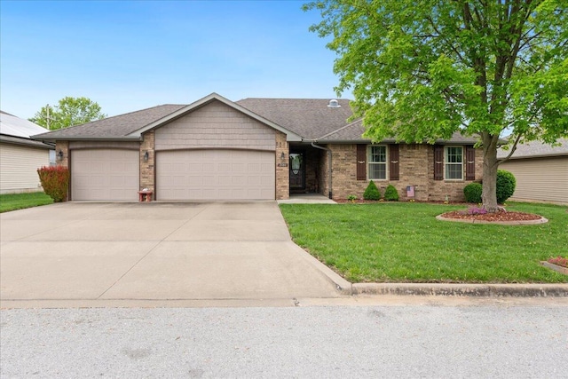 single story home featuring driveway, a front yard, a garage, brick siding, and a shingled roof