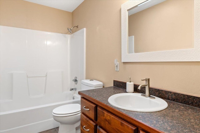 full bath featuring vanity, toilet, and shower / washtub combination