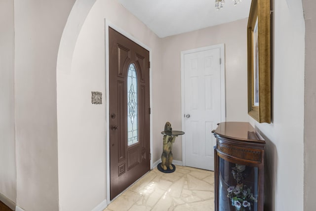 3660 S Ferguson Ave, Springfield, MO 65807 - entrance foyer featuring arched walkways, baseboards, and marble finish floor