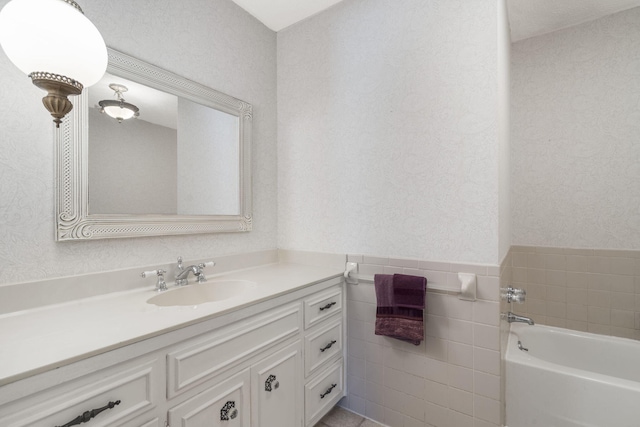 3660 S Ferguson Ave, Springfield, MO 65807 - bathroom featuring tile walls, a garden tub, and vanity