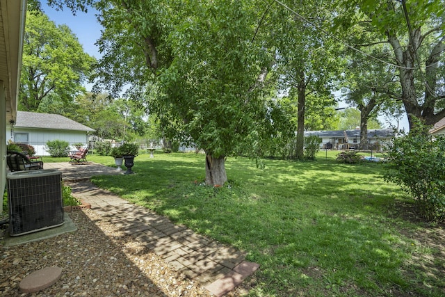 3660 S Ferguson Ave, Springfield, MO 65807 - view of yard with fence, cooling unit, and a patio area