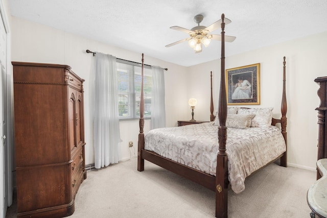 3660 S Ferguson Ave, Springfield, MO 65807 - bedroom with baseboards, a textured ceiling, ceiling fan, and light carpet