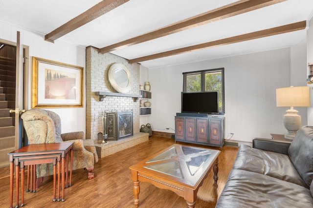 3660 S Ferguson Ave, Springfield, MO 65807 - living area featuring a brick fireplace, wooden walls, beamed ceiling, and wood finished floors