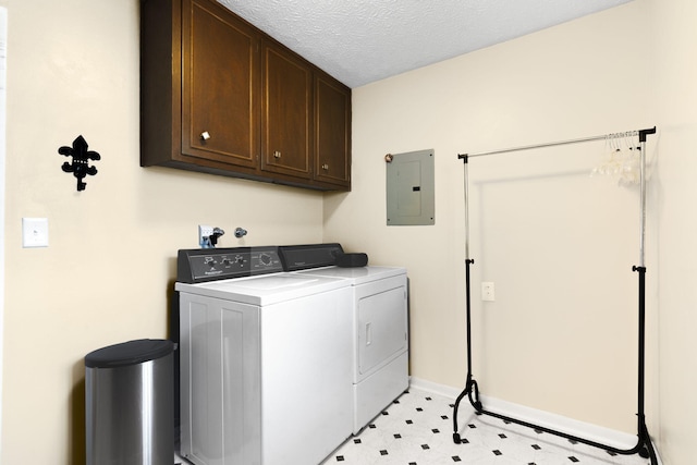 3660 S Ferguson Ave, Springfield, MO 65807 - laundry area featuring washing machine and dryer, baseboards, a textured ceiling, electric panel, and cabinet space