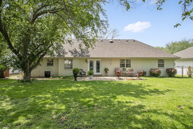 3660 S Ferguson Ave, Springfield, MO 65807 - back of property with central AC, fence, a patio, french doors, and a yard