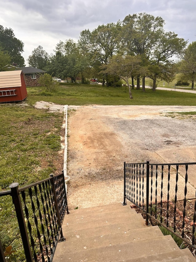 exterior space featuring a storage unit and an outdoor structure