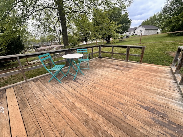 wooden deck with a yard