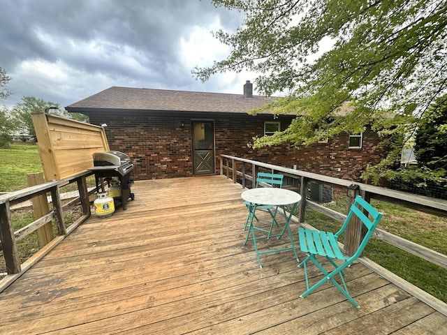 deck featuring a grill