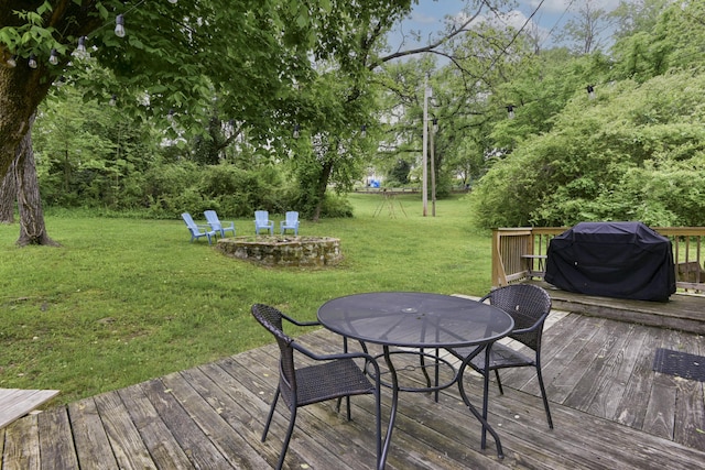 418 S 5th St, Branson, MO 65616 - wooden terrace with a lawn, outdoor dining area, grilling area, and view of scattered trees