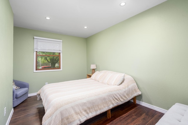 bedroom with baseboards, recessed lighting, and wood finished floors