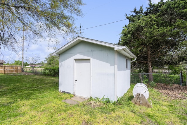 view of shed with a fenced backyard