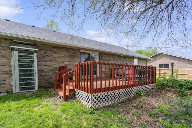 wooden deck featuring fence