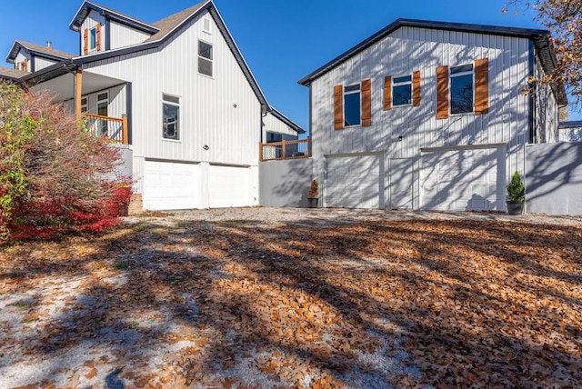 rear view of house with an attached garage