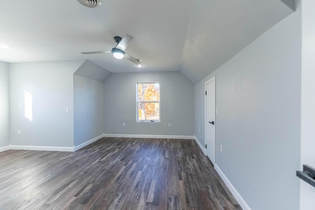 bonus room with baseboards, dark wood-style floors, ceiling fan, and lofted ceiling