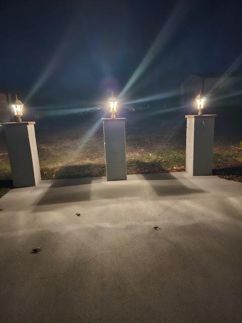410 White Oak Dr, El Dorado Springs, MO 64744 - view of garage at twilight
