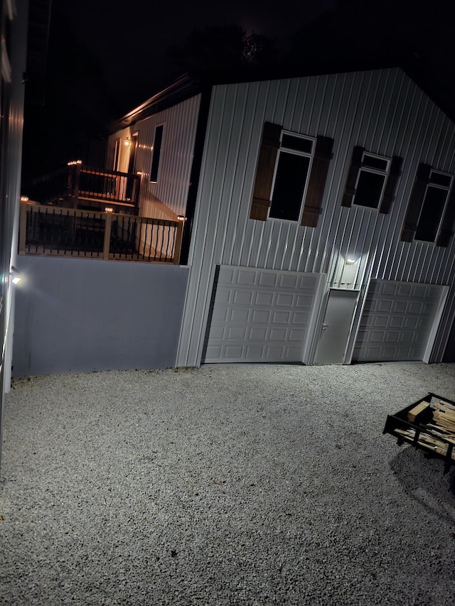 410 White Oak Dr, El Dorado Springs, MO 64744 - property exterior at night with a garage