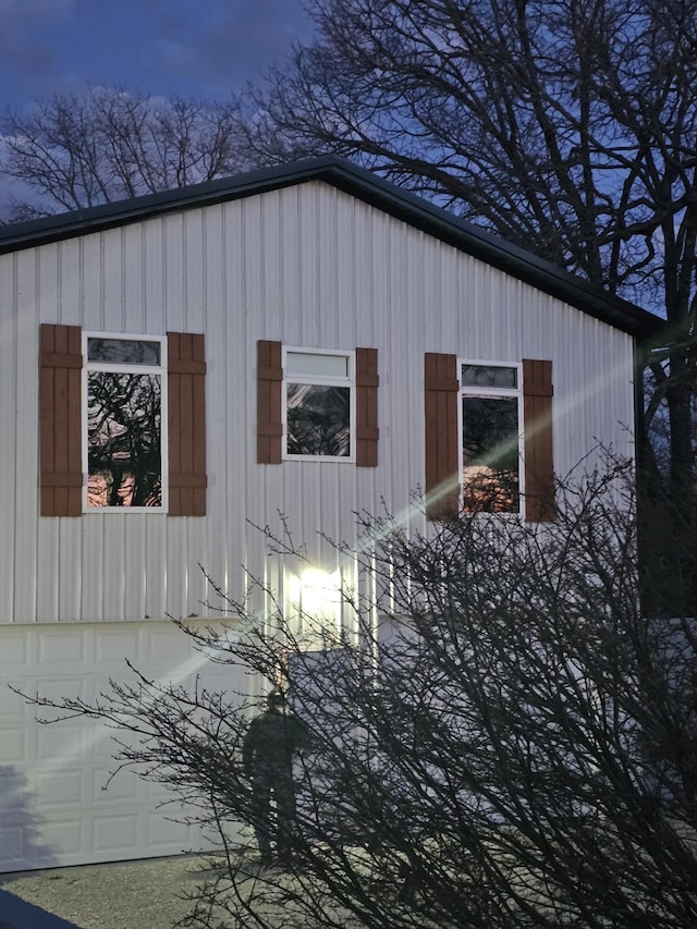 410 White Oak Dr, El Dorado Springs, MO 64744 - view of side of home with board and batten siding