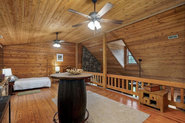 121 Waverly St, Hollister, MO 65672 - bedroom with visible vents, wood walls, wood ceiling, hardwood / wood-style flooring, and vaulted ceiling